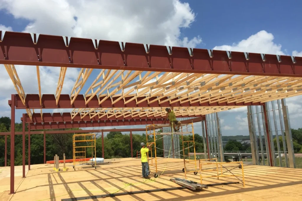 Two Cosand employees working on rough carpentry beams for Stockwell