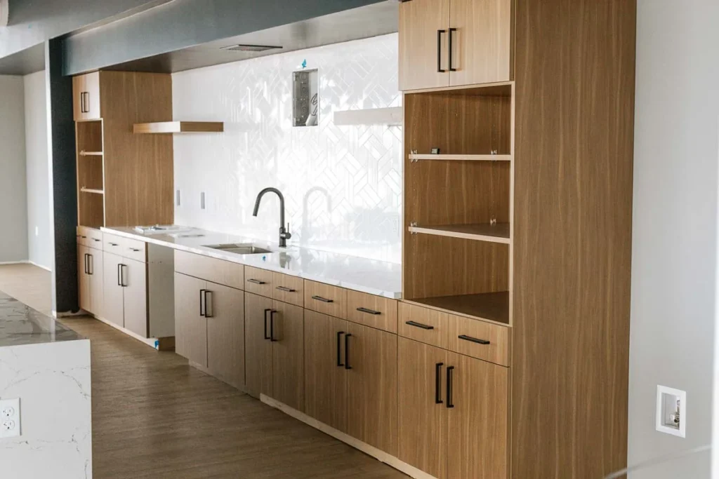 Kitchen counter and wooden shelving with cabinets